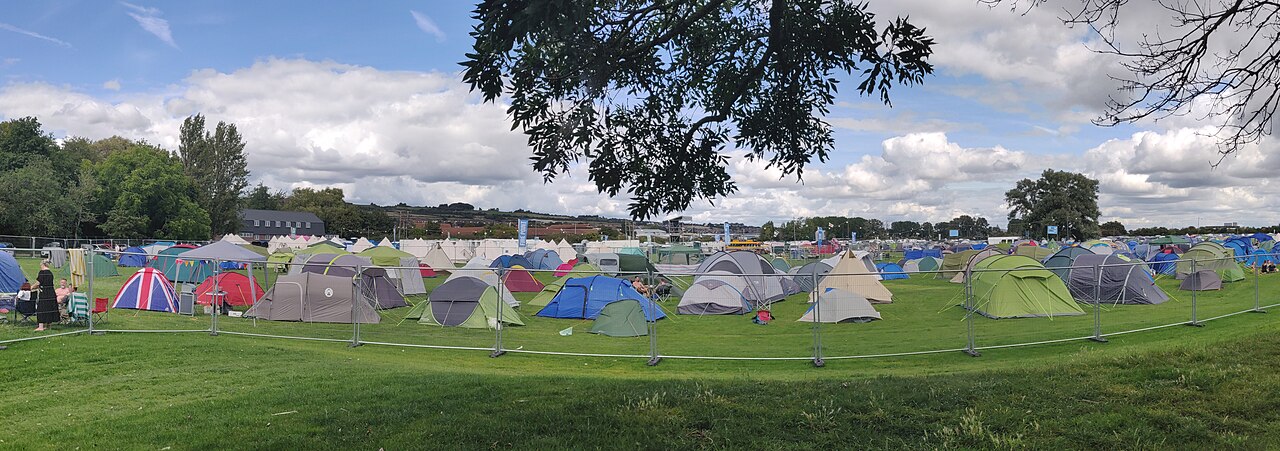 Rows of tents pitched across a festival campground